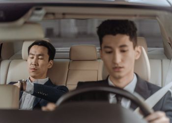 Professional chauffeur assisting passengers with a comfortable airport transfer in Cape Town